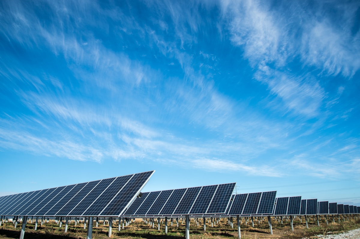Solar panel installation on a residential rooftop under clear blue sky